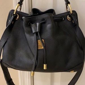 MCM Buckle style two way sling bag.